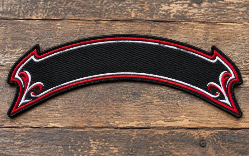 Original curved motorcycle rocker patch with embroidered red and white border