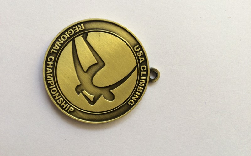 decide what belongs on the back of the medal
