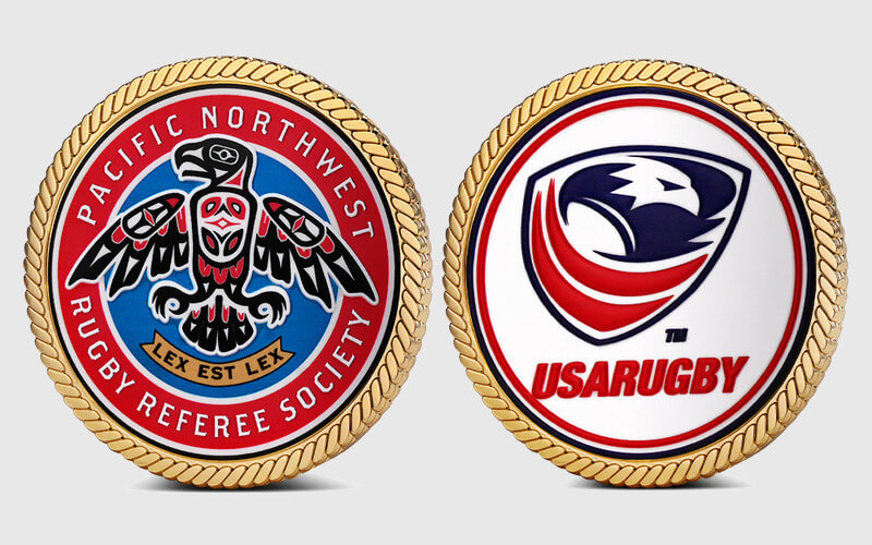 Two UV printed challenge coins showing detailed logos and full color