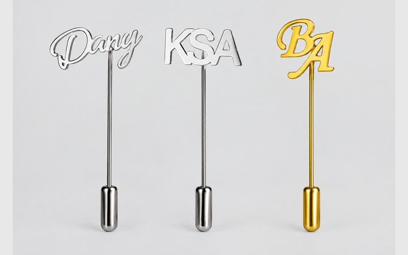 Initial stick pins showing different letter fonts and layouts