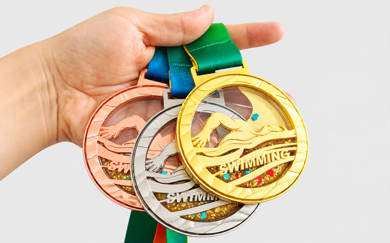 Special effects for custom swimming medals
